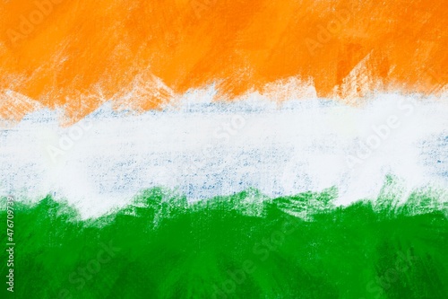 Abstract wall surface painted with Indian flag colours with rough brush strokes