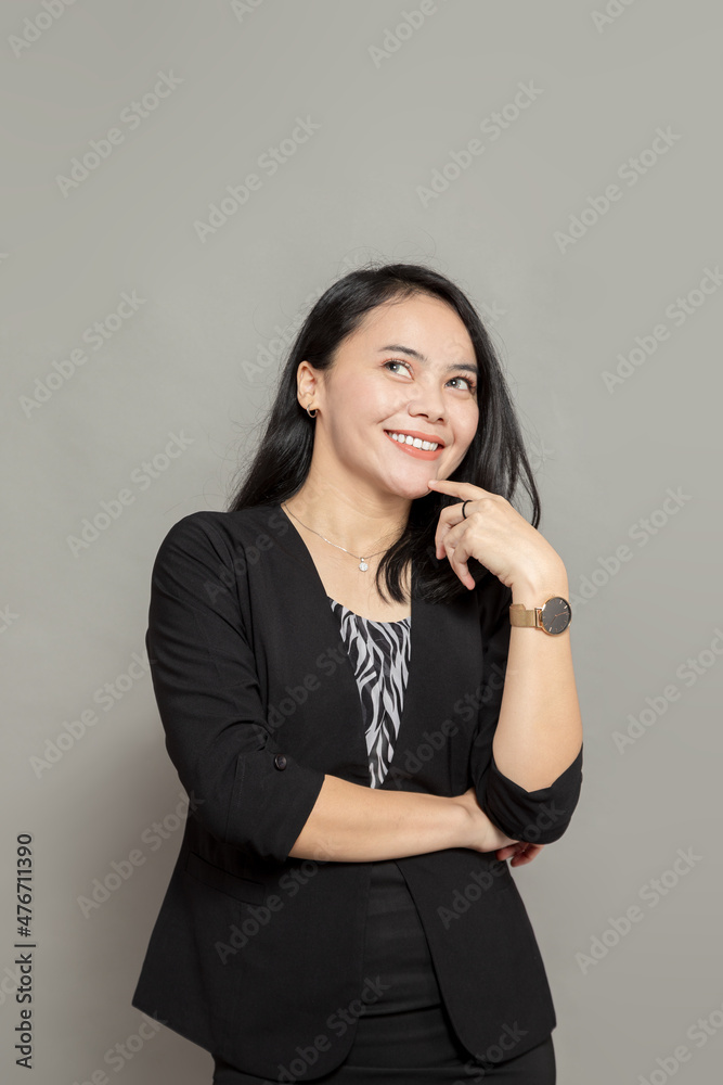 Happy woman smile while looking up isolated on plain background