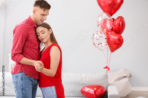 Happy couple spending time together at home. Valentine's Day celebration