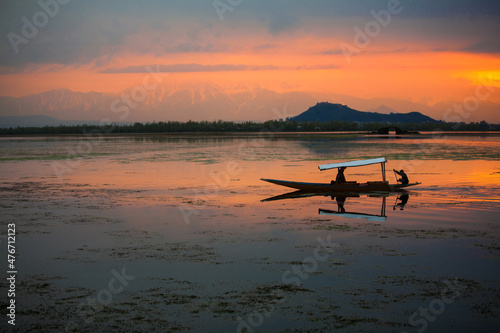 Dal Lake is The second largest in the state, Local people and traveler are use small wooden boat call 'Shikara' is a vehicle in the lake photo