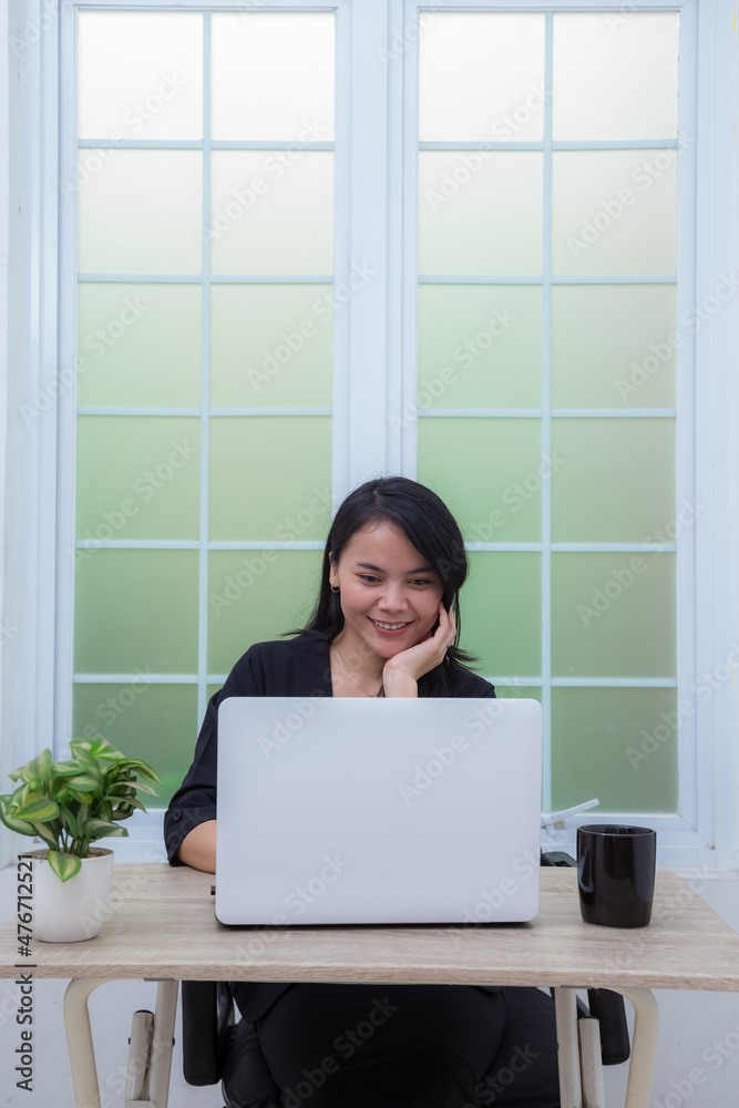 Beautiful woman working with laptop at office desk Beautiful woman working with laptop at office desk