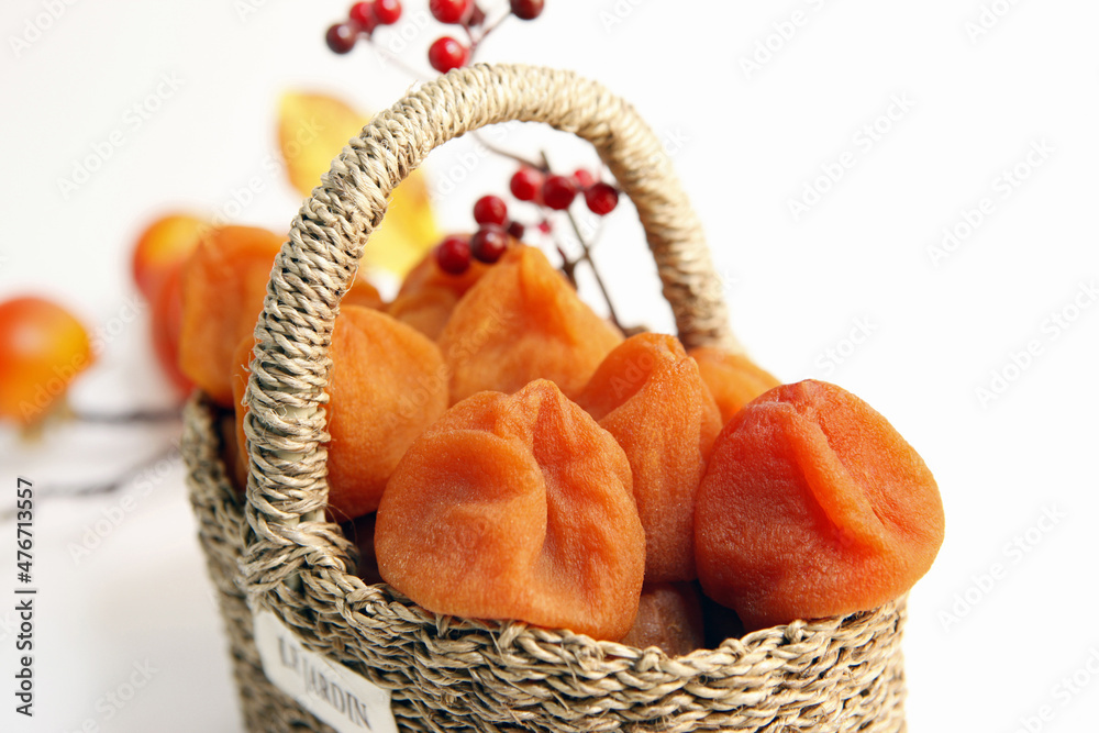 Well dried dried persimmons in a basket
