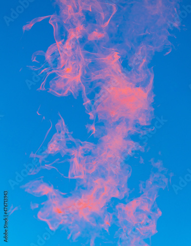 Red smoke on a blue background.