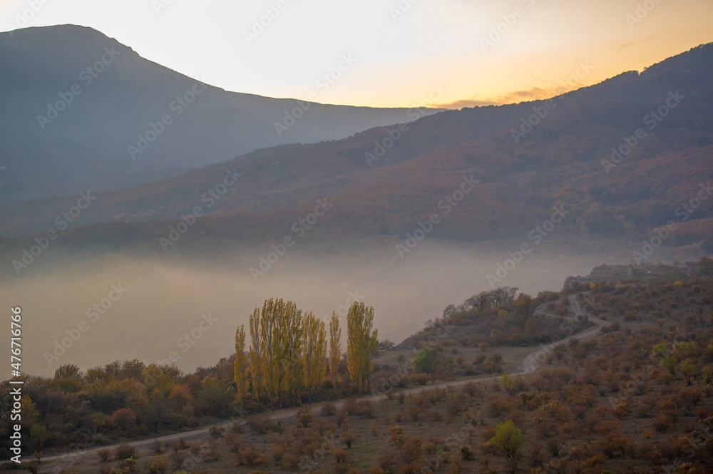 Autumn photos of the Crimean peninsula, fog of Mount Demerdzhi, evaporation of water from the Black Sea, sunset sunrises. product of the power of nature: wind rains and earthquakes.