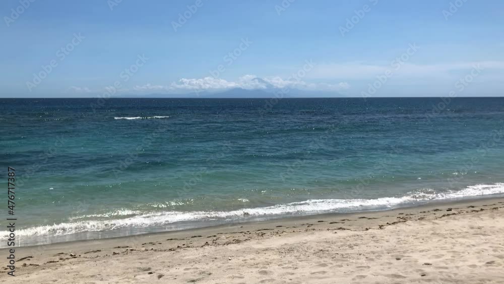 View of Mount Batur in Bali through the strait from the island of Lombok, Indonesia, slow motion View of Mount Batur in Bali through the strait from the island of Lombok, Indonesia, slow motion