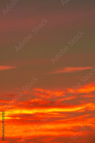Photo of the sky with clouds, sunrises, sunsets, orange-yellow tones from the setting sun © Татьяна Мищенко