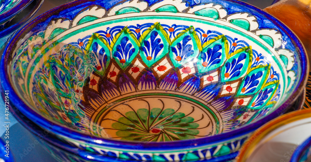 Texture, background, pattern, folk art. Uzbek national ceramic products. Hand painted with national pattern. Kese Dishes Bowls