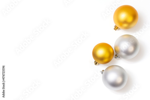 gold and silver christmas balls on white