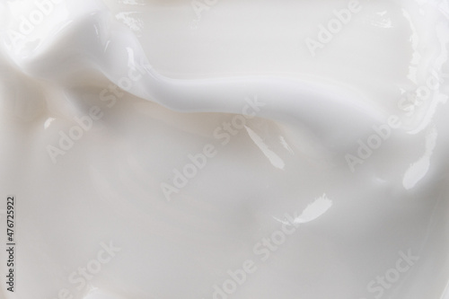 Close-up cream moisturiser smear smudge wavy texture on white background. Skin care beauty product