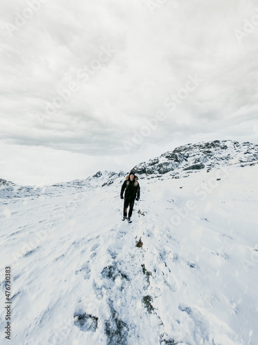 Hiker in the snowy mountains.Ben Narnain, Scotland. Located in the southern Highlands of Scotland, near Arrochar. It forms part of a group of hills known as the Arrochar Alps, and 
