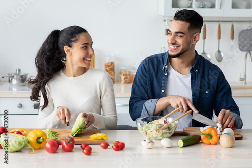 Young Arab Spouses Cooking Healthy Lunch Together In Kitchen At Home