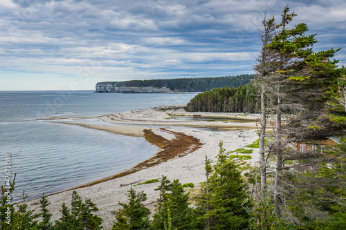 Fototapeta Naklejka Na Ścianę i Meble -  View on the St Lawrence river estuary and the shoreline in Vaureal, on Anticosti island, in Cote Nord region of Quebec, Canada