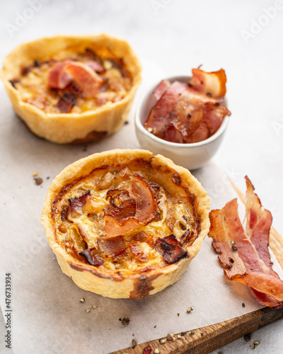 Mini pies with onion and bacon. Hearty pastries