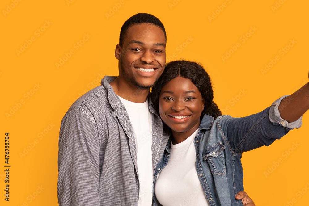 Closeup Of Positive African American Lovers Taking Selfie Together Closeup Of Positive African American Lovers Taking Selfie Together