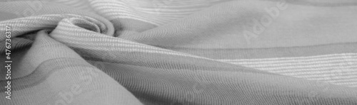 Texture. Background. Monochrome gray silk fabric, a photograph o