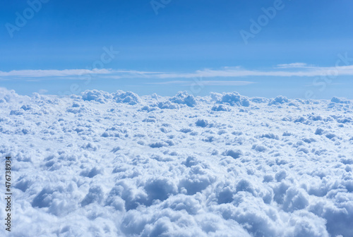 Clouds seen through the aircraft porthole © Katie Chizhevskaya