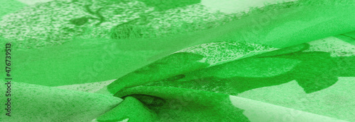 Texture. background. template. Abstract green silk chiffon fabri photo