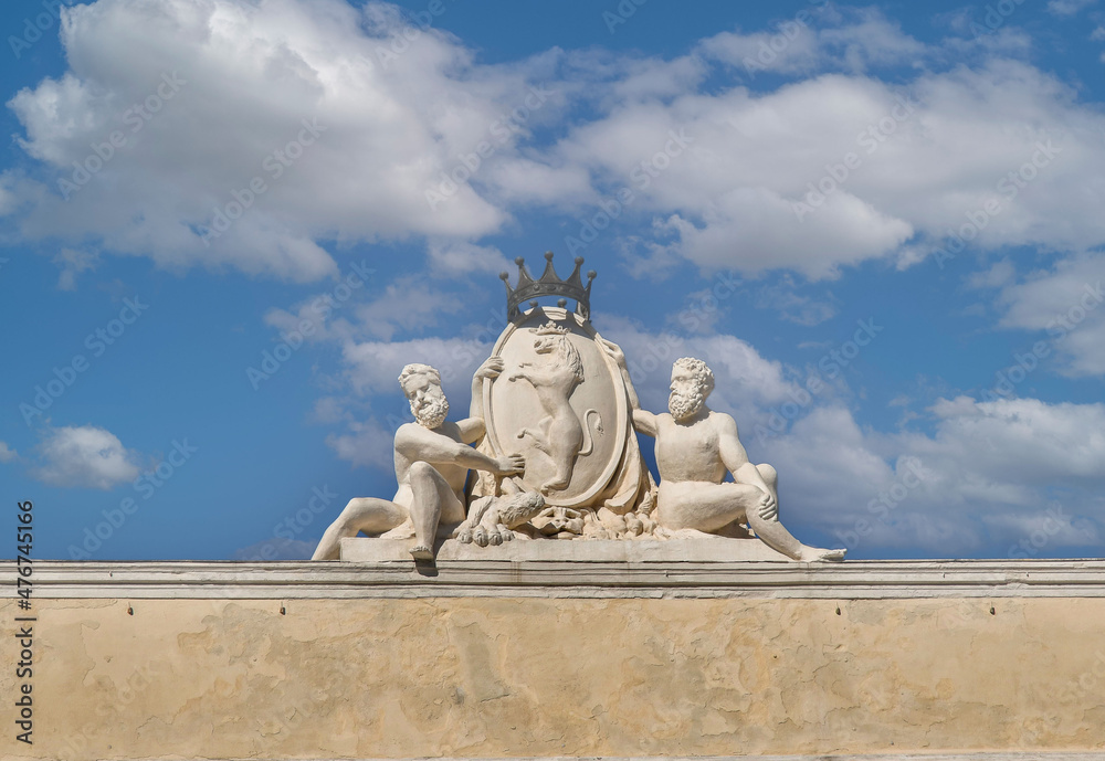 Top of Agostino Spinola Palace, also called Doria De Ferrari Galliera Palace, overlooking Piazza De Ferrari square, with marble statues against clear blue sky, Genoa, Liguria, Italy