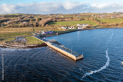 Coastal road and pier next to the Atlantic in Mountcharles in County Donegal - Ireland.