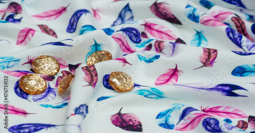 Cotton, jersey fabric. bird feather print on white background. A jersey made from cotton is usually a thin single knit fabric with an obvious right side and back,