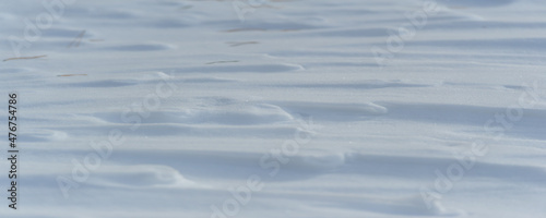 Snow covered the ground. Sunny day. Panoramic photography. Soon the warm spring sun will melt the winter snows. consists of many soft white pieces of frozen water that fall from the sky