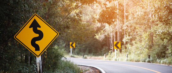 Traffic sign Dangerous curve on the road