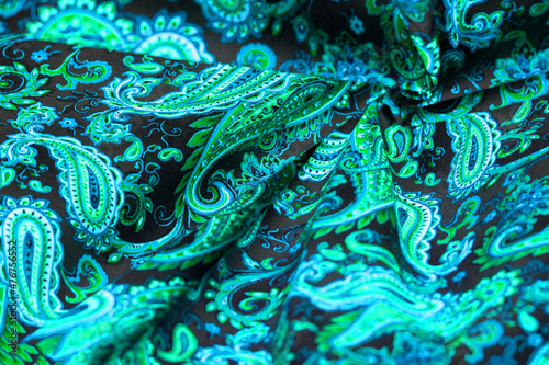 Paisley green pattern on black background In Chinese it is known as “ham pattern” In Russia this pattern is known as “cucumbers”. Boteh is a Persian word meaning bush, bunch of leaves or flower bud