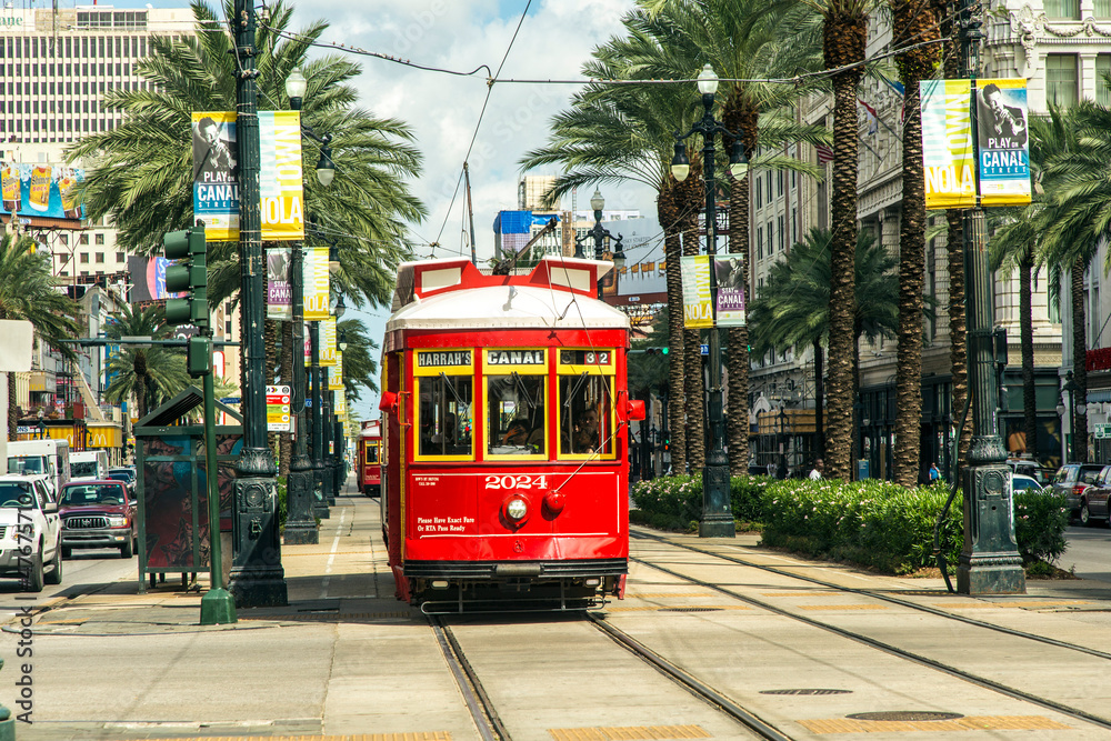 red trolley streetcar on rail in New Orleans French Quarter Stock Photo ...