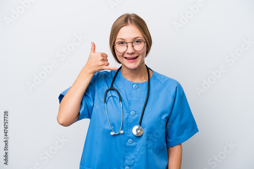 Young nurse doctor woman isolated on white background making phone gesture. Call me back sign © luismolinero