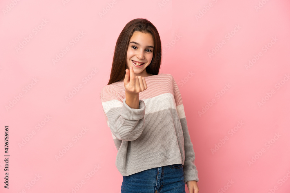 Little girl isolated on pink background making money gesture Little girl isolated on pink background making money gesture