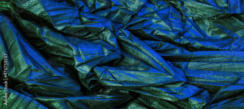 texture. background. pattern. wallpaper. black silk fabric with blue emerald stripes, wrinkled fabric © Татьяна Мищенко