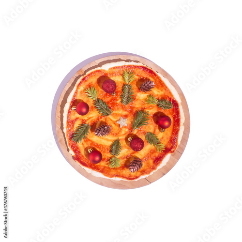 Pizza with christmas tree decoration as ingredients. New year flat lay concept. Minimal creative Christmas idea.