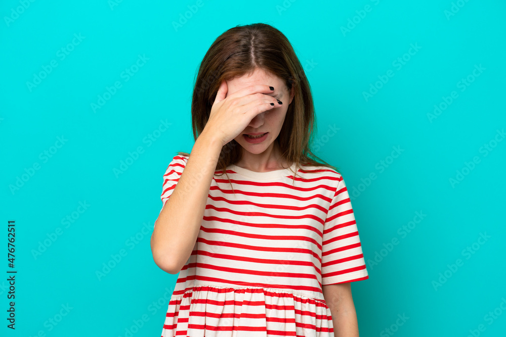 Young English woman isolated on blue background with headache
