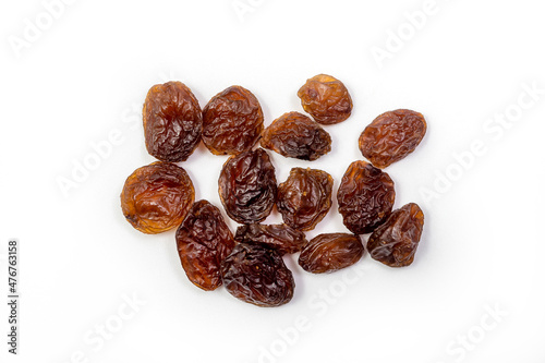 Raisins on white background, dried seedless grapes. Isolated Raisin 