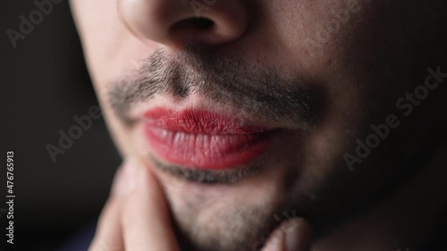 Closeup of a Queer Man With Red Lipstick and Beard photo