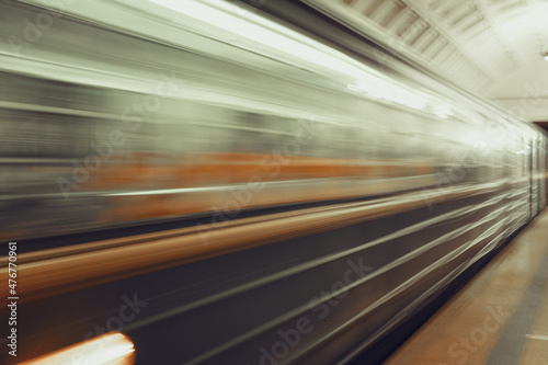 A greased train at high speed rushing past at a metro station © Ekaterina