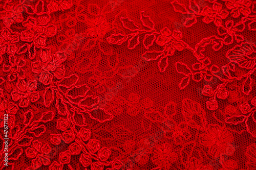 Colored red lace fabric. Vintage. Flowers background in Provence style. Decorative ornament background for fabric, textile, wrapping paper, cards, invitations, wallpaper, web design.