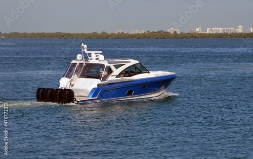 Fototapeta High-end white and blue motorboat