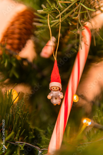 Beautifully decorated Christmas tree with different toys and symbols photo