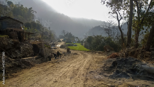 People work along the road in the nepalese village