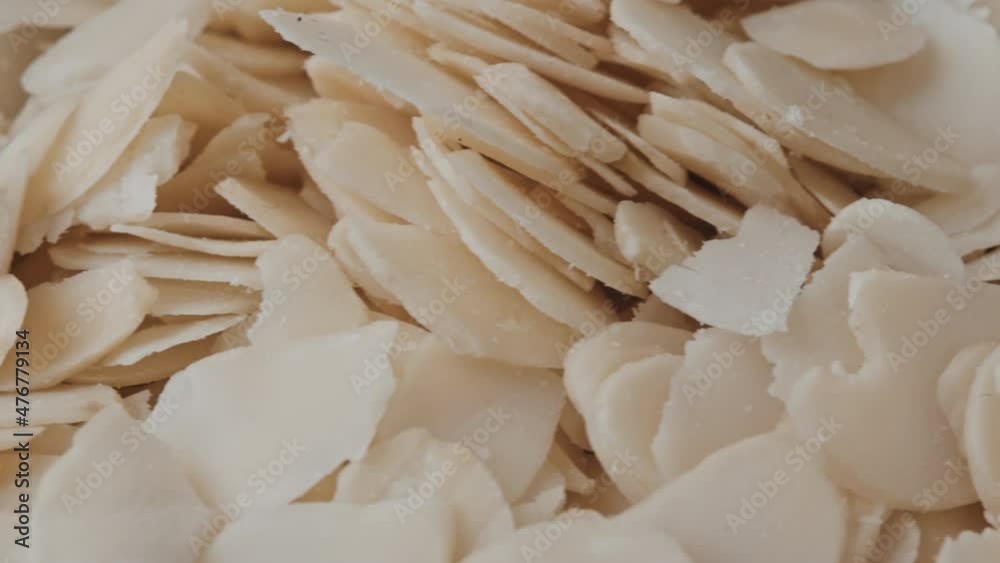 Extreme close up tracking of bunch of almond flakes Extreme close up tracking of bunch of almond flakes