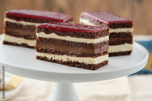 Classic french opera cake. Opera cake with raspberries. Chocolate cake.