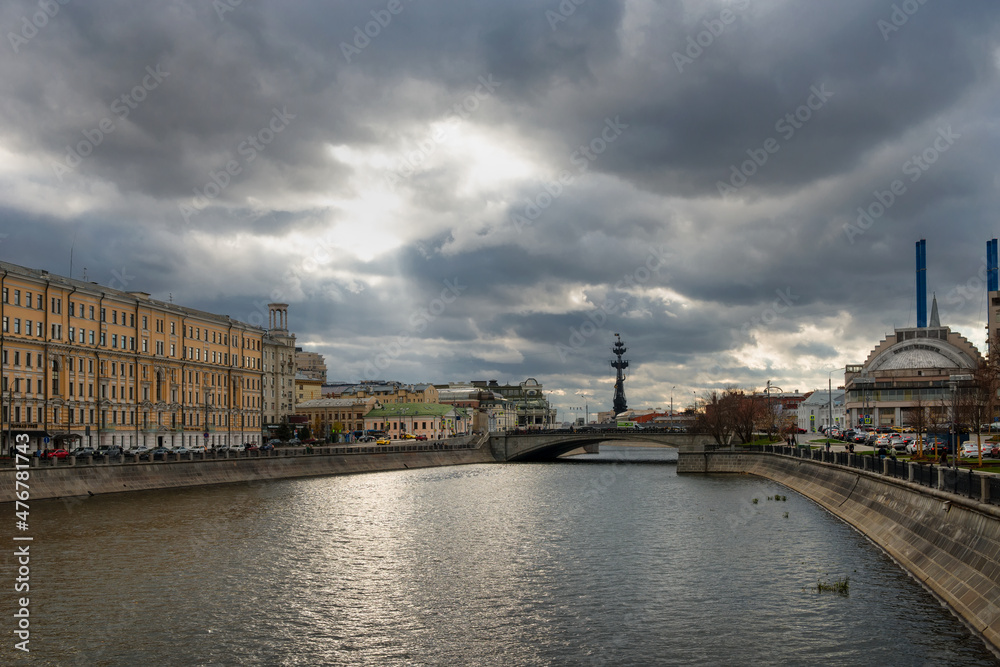 The house on the embankment, the Drainage canal, the Small Stone Bridge, the Udarnik cinema and the blue pipes of HPP-2. Urban autumn landscape