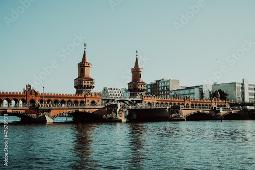 Oberbaum Bridge is a double-deck bridge crossing over river Spree, which connects districts Kreuzberg and Friedrichshain