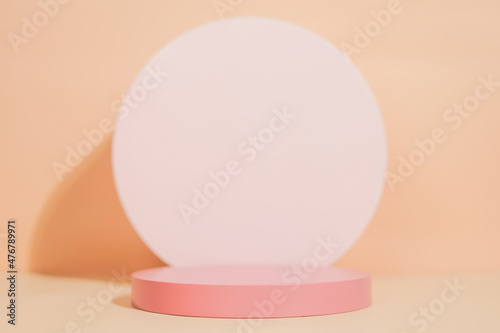 Fototapeta Naklejka Na Ścianę i Meble -  product platform arrangement in pink pastel color in minimalist style. trendy display layout with an empty podium for showcasing cosmetics, skincare, or other products.                               
