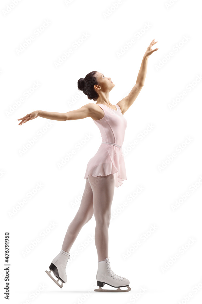 Full length profile shot of a young female performing figure skating
