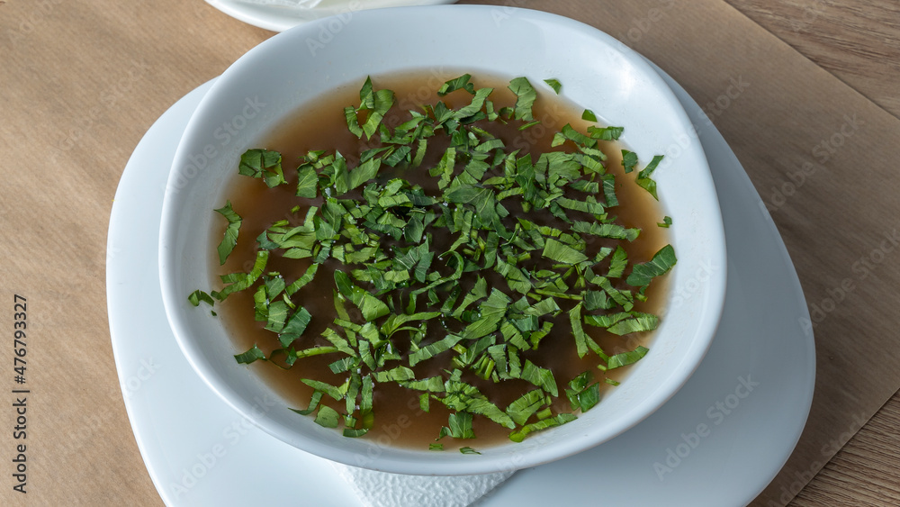 Close-up view of mushroom soup with green onions and champignons. Healthy food concepts. Close-up view of mushroom soup with green onions and champignons. Healthy food concepts.