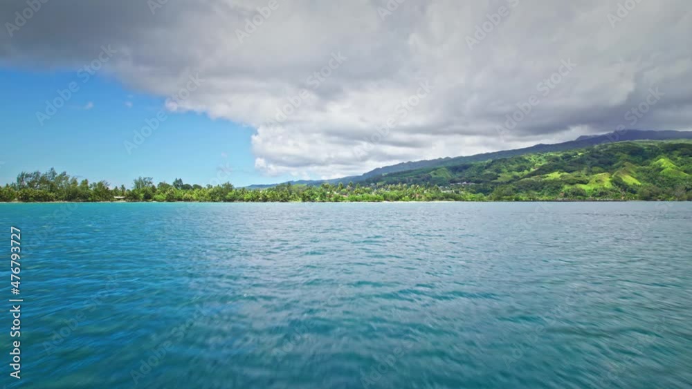 Drone flying close to water approaching tropical island. Nature in French polynesia in pacific ocean. Drone flying close to water approaching tropical island. Nature in French polynesia in pacific ocean.