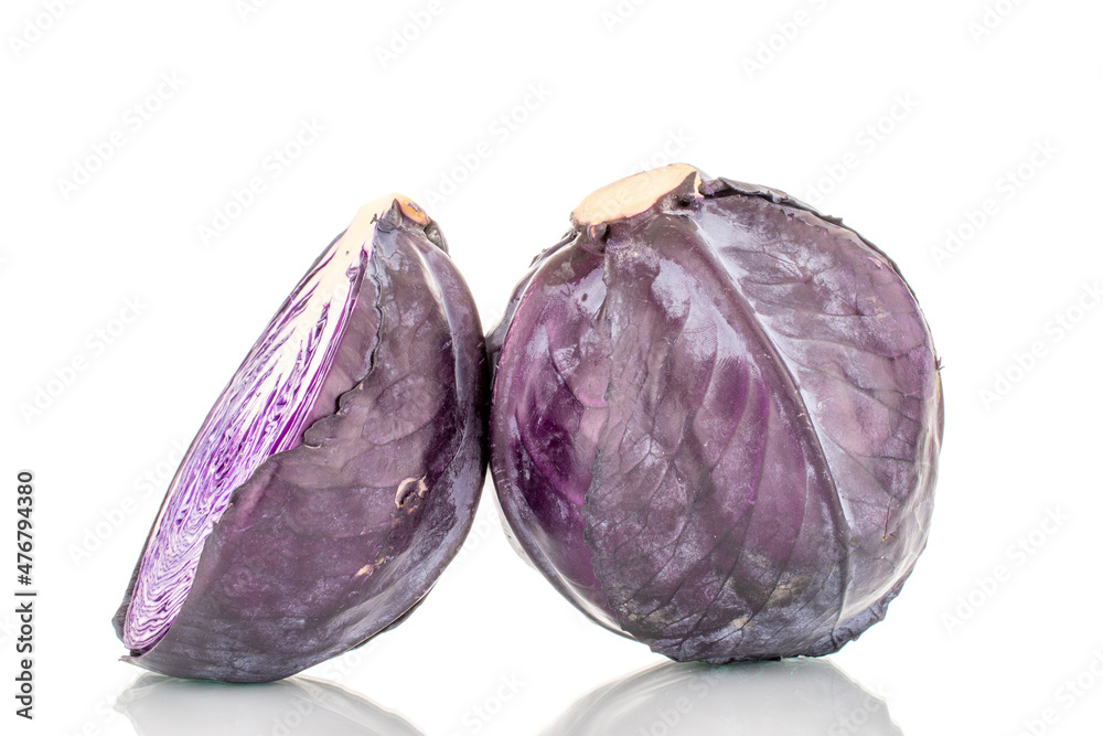 One whole and one half of fresh red cabbage, close-up, isolated on white. One whole and one half of fresh red cabbage, close-up, isolated on white.