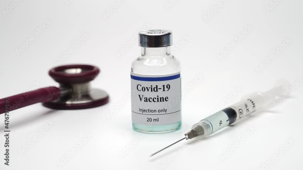 covid-19 vaccine bottle with syringe on white background covid-19 vaccine bottle with syringe on white background